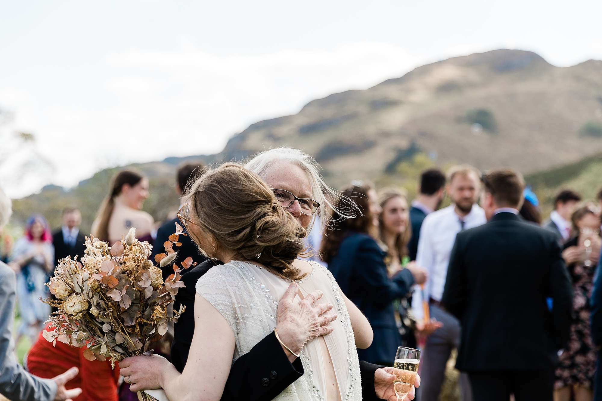 bride hugging a wedding guest