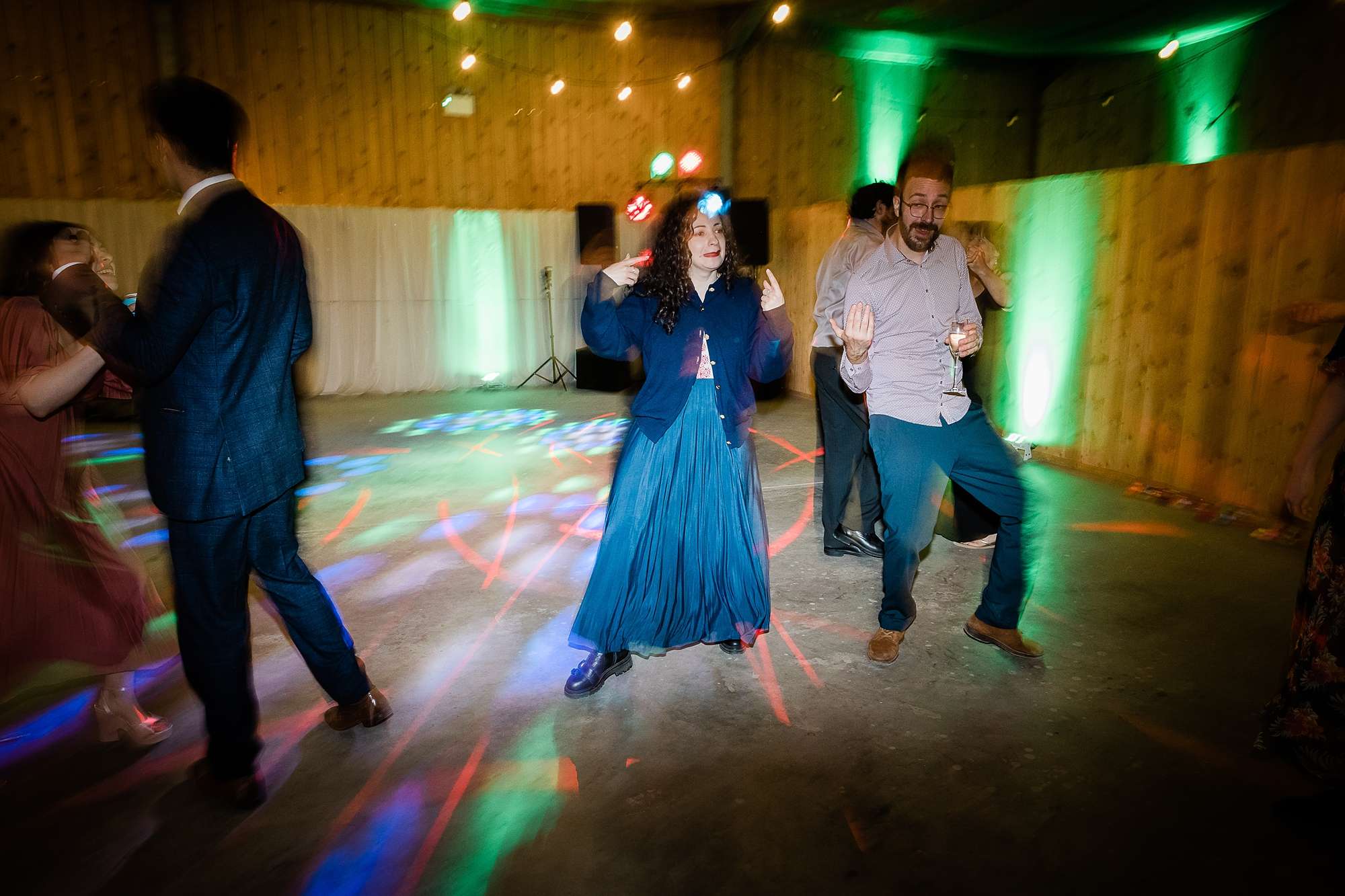 wedding guests dancing and bright strobe lights at a wedding at Carrick Castle Estate