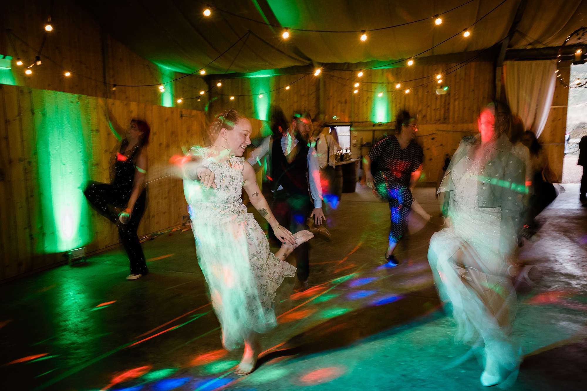 wedding guests dancing and strobe lights at a wedding at Carrick Castle Estate
