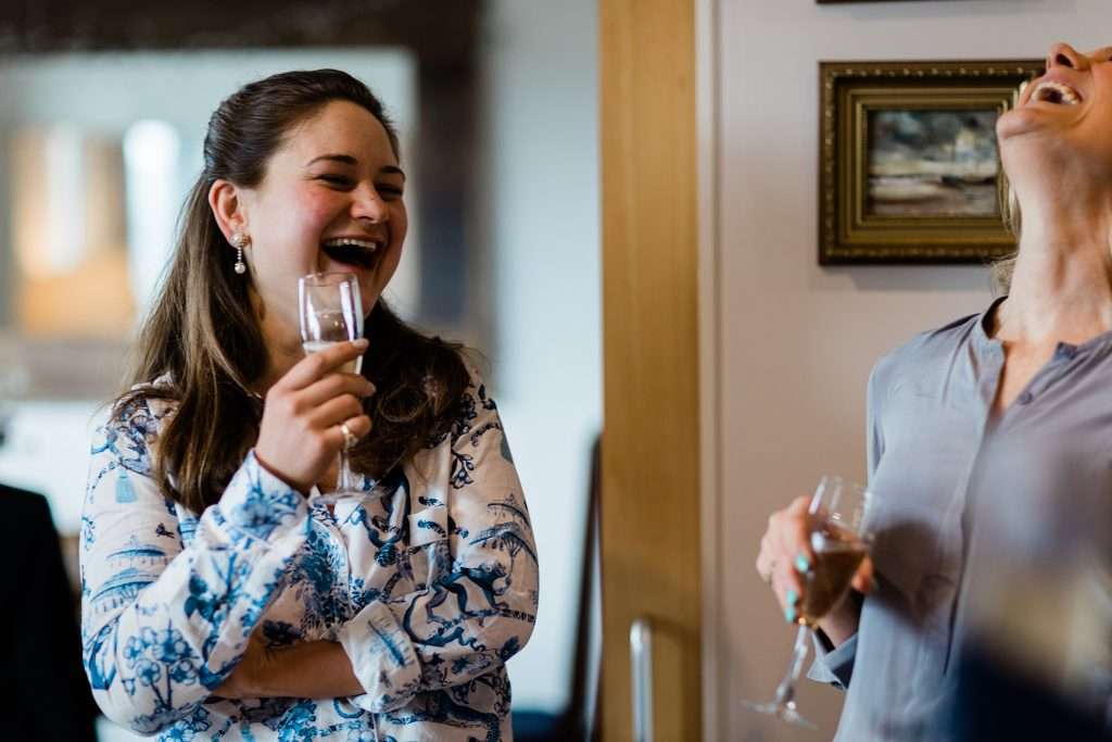 woman and mother laughing and drinking