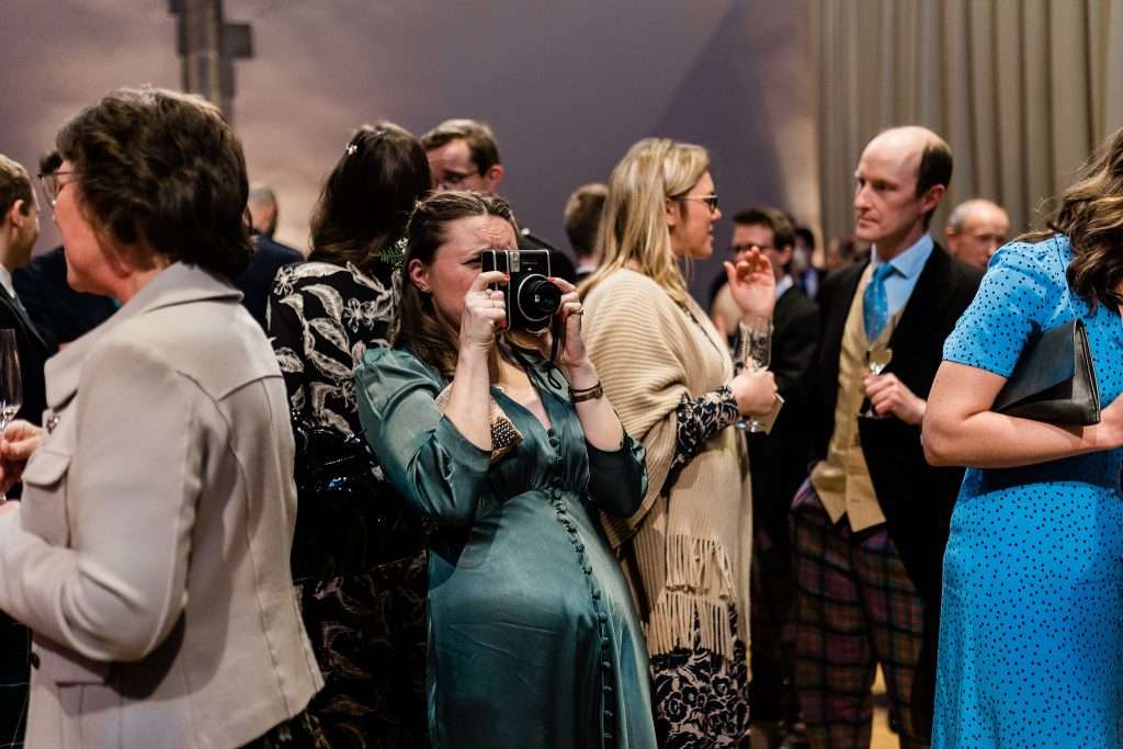 wedding guest taking photographs