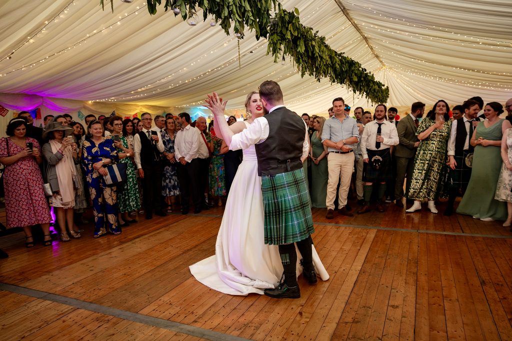 bride and groom first dance in a marquee at a Scottish garden wedding