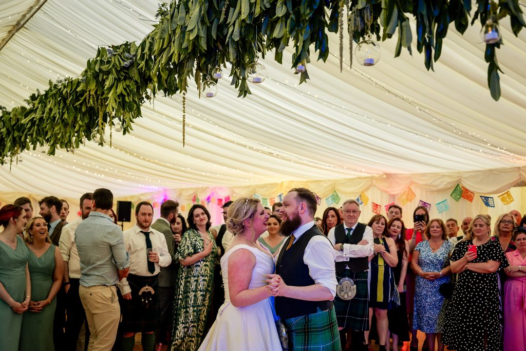 bride and groom dancing in a marquee at a Scottish garden wedding