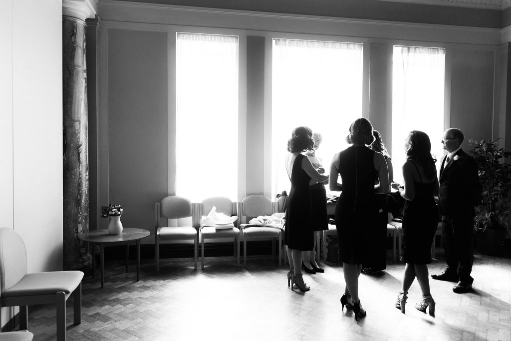 bridesmaids talking in a hall at Leith Theatre