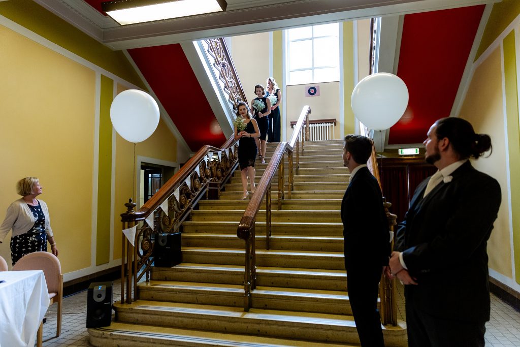 bridesmaids decending staircase at Leith Theatre wedding