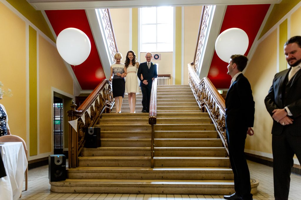 bride and parents decending staircase at Leith Theatre wedding