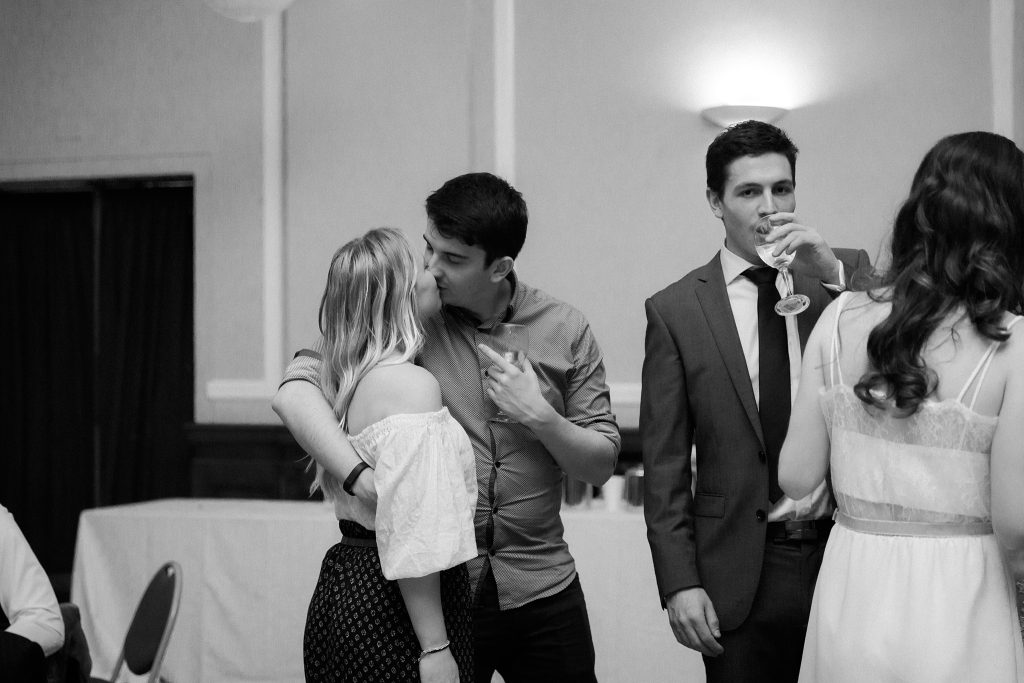 wedding guests kissing  at Thomas Morton Hall in Leith Theatre
