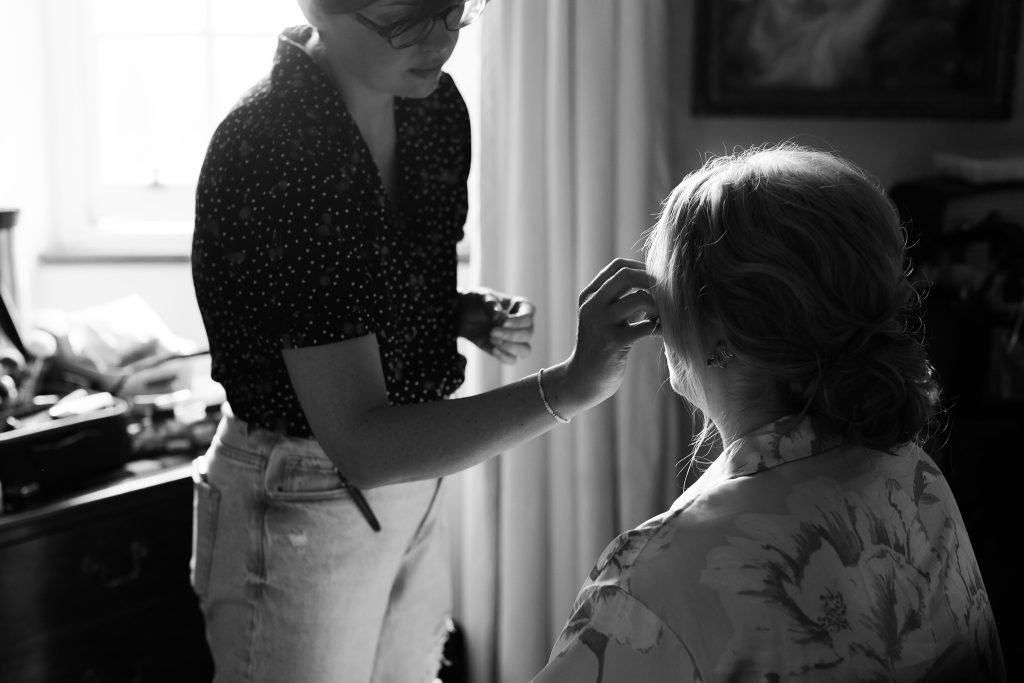 bride having make up applied