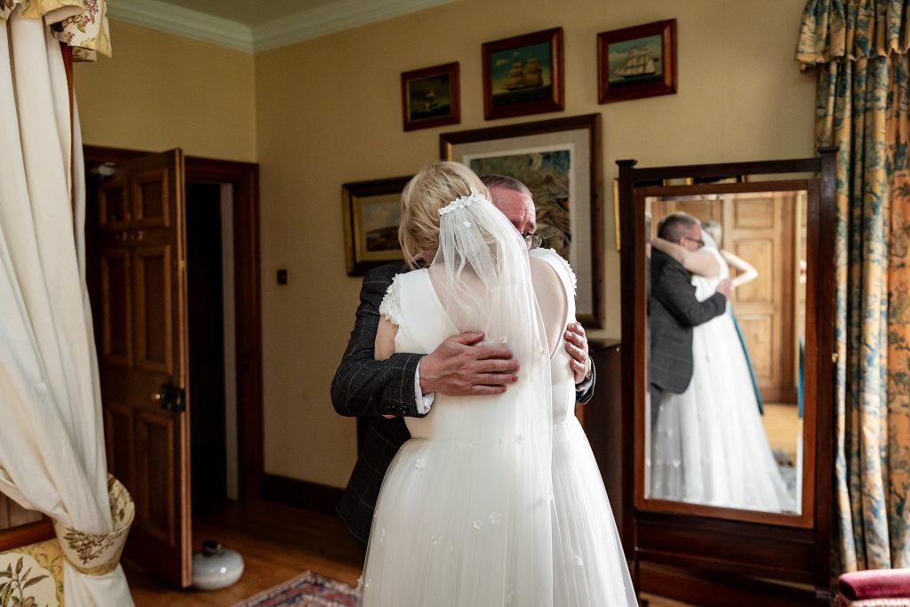 bride hugging her dad