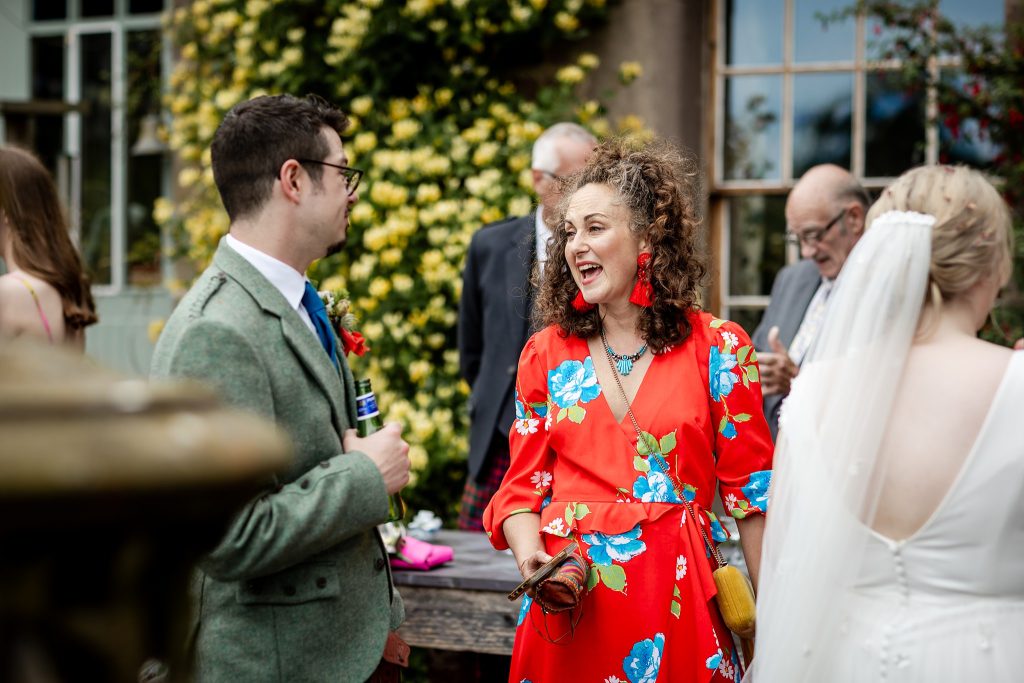 wedding guests mingling at outdoor wedding at Fingask Castle