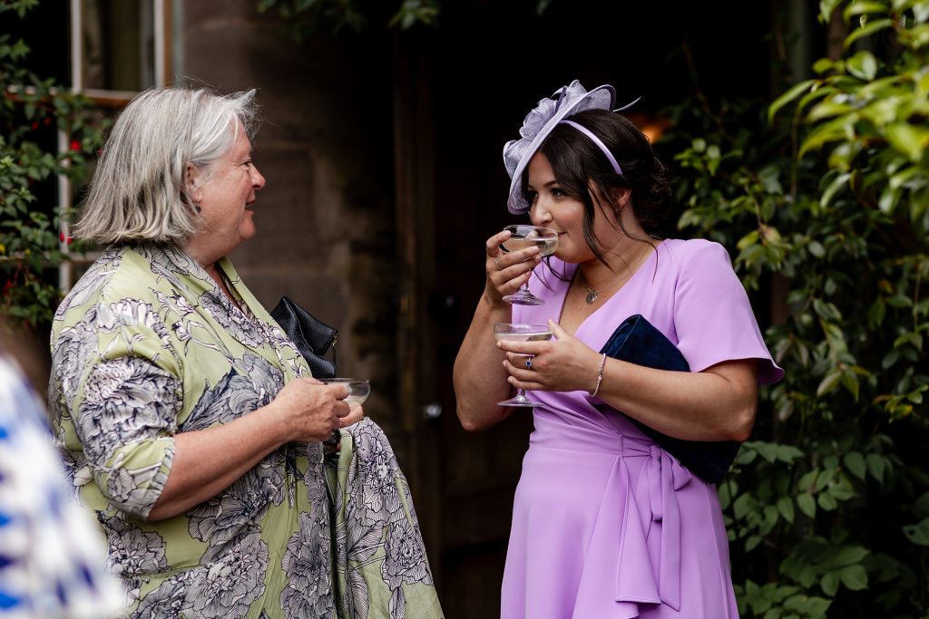 wedding guests mingling at outdoor wedding at Fingask Castle