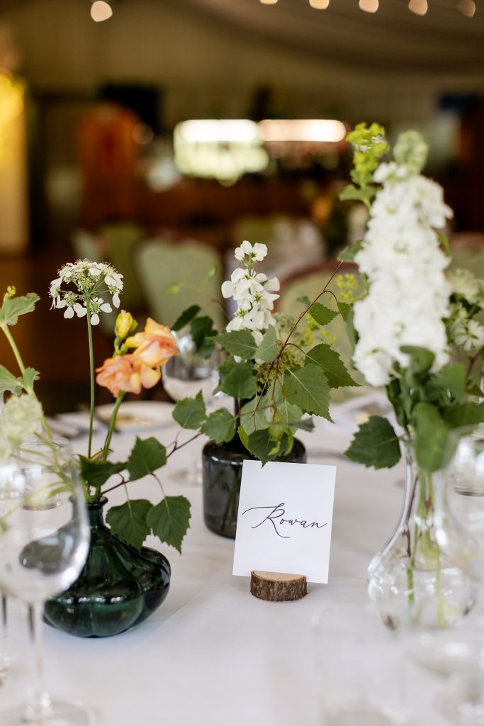 woodland themed table flowers at a wedding