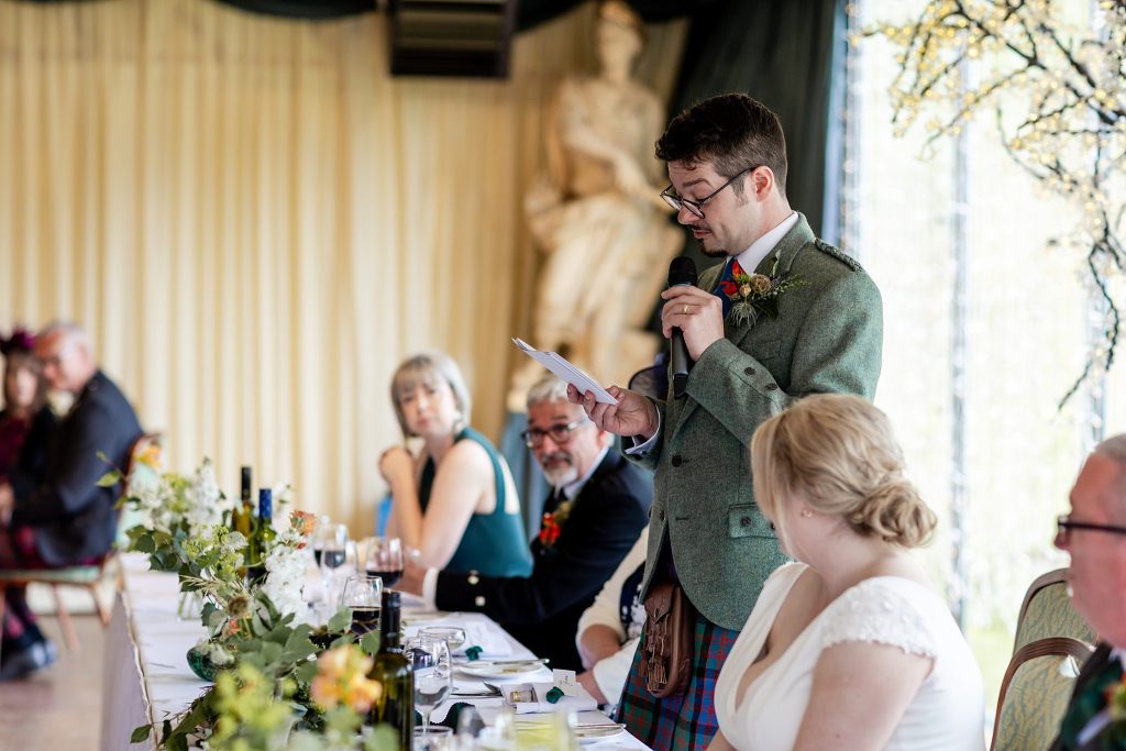 groom reading out a speech 