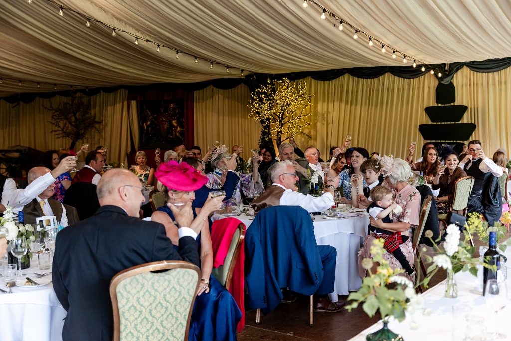 wedding guests toasting speeches at Fingask Castle pavilion 