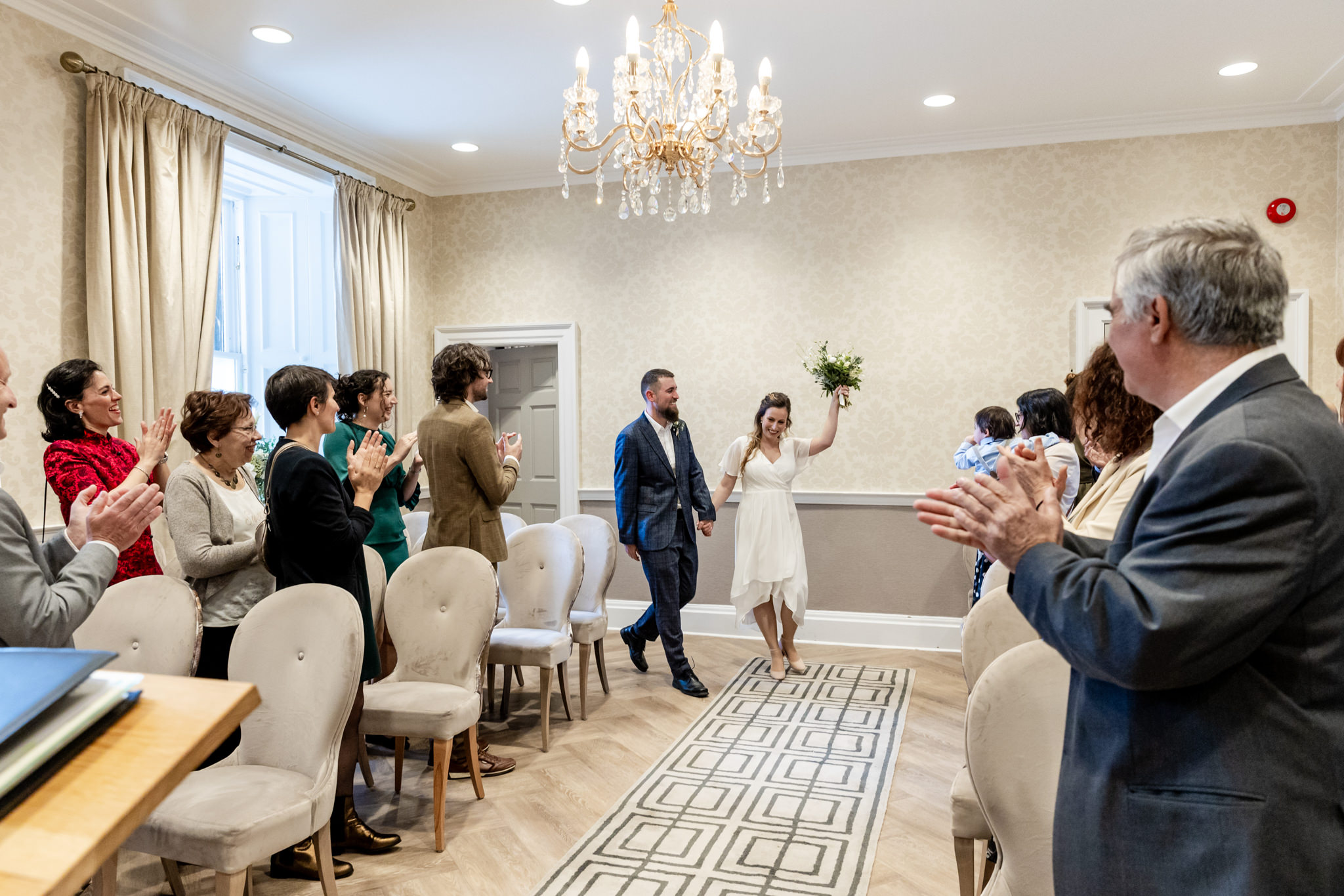 bride and groom after wedding ceremony in room at City Chambers wedding in Edinburgh