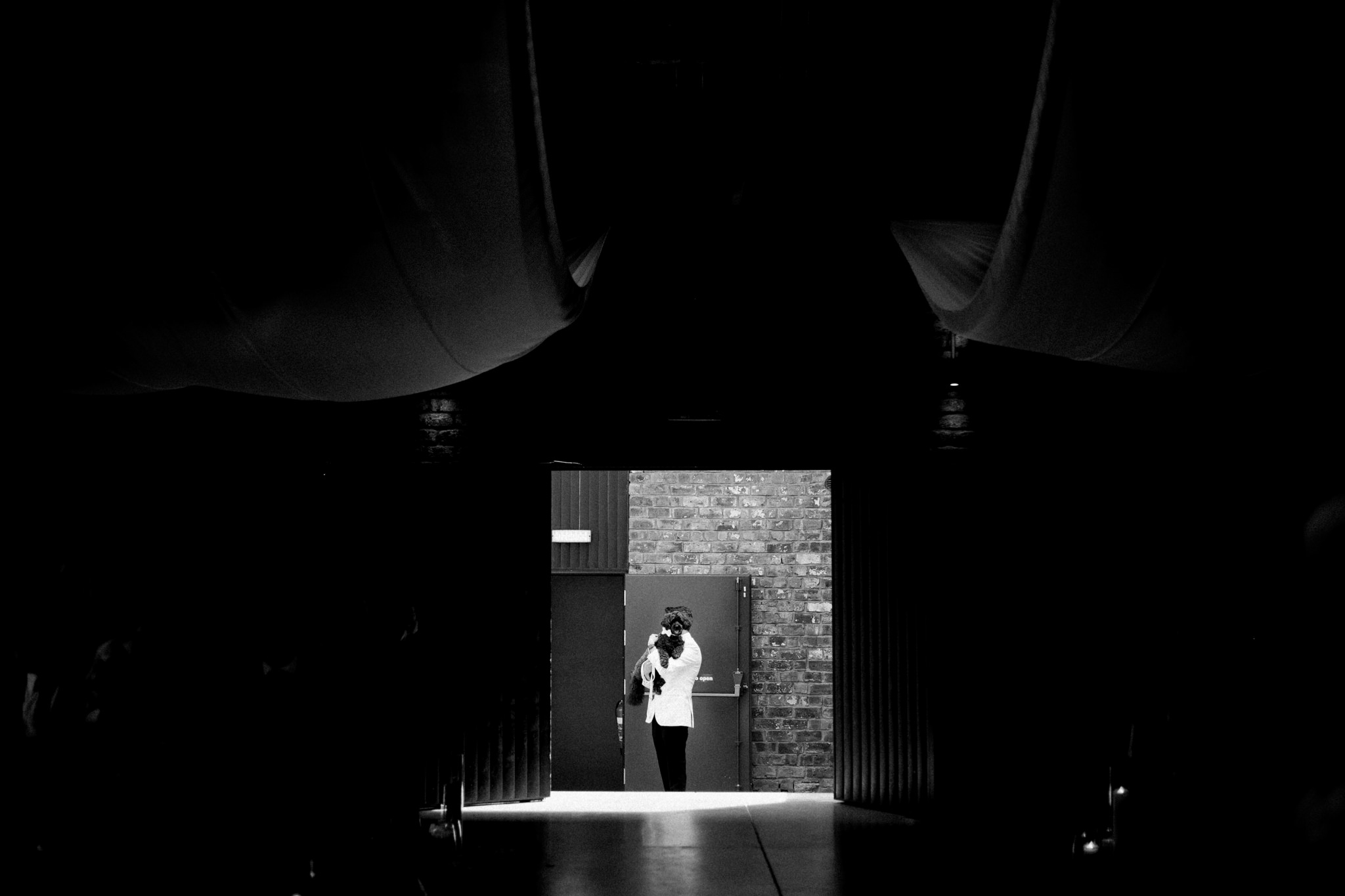 groom waiting to go into ceremony