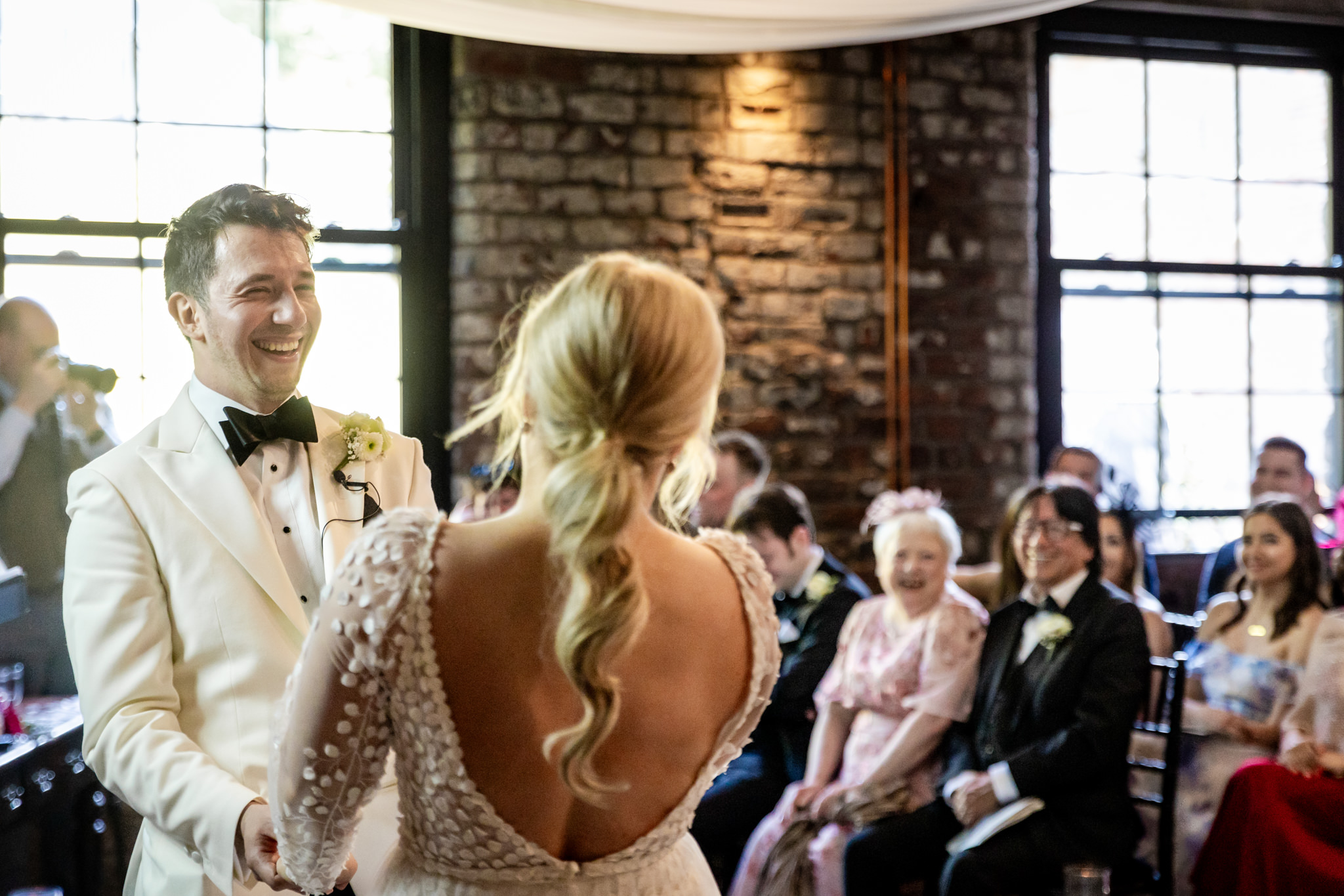 groom and bride laughing at a wedding at The Engine Works, Glasgow 
