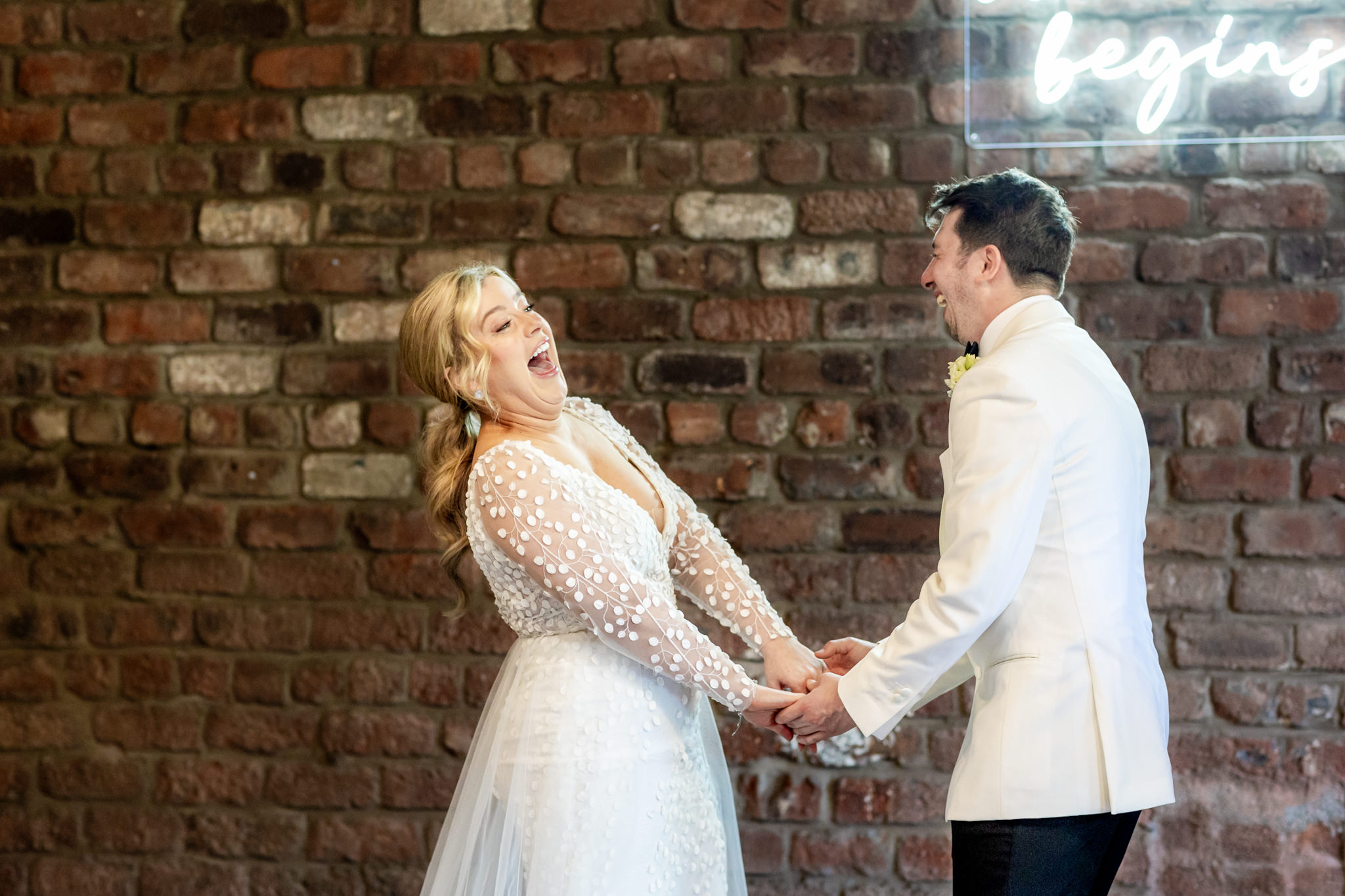 bride laughing during her ceremony to her groom in a white tux jacket at Engine Works Wedding in Glasgow
