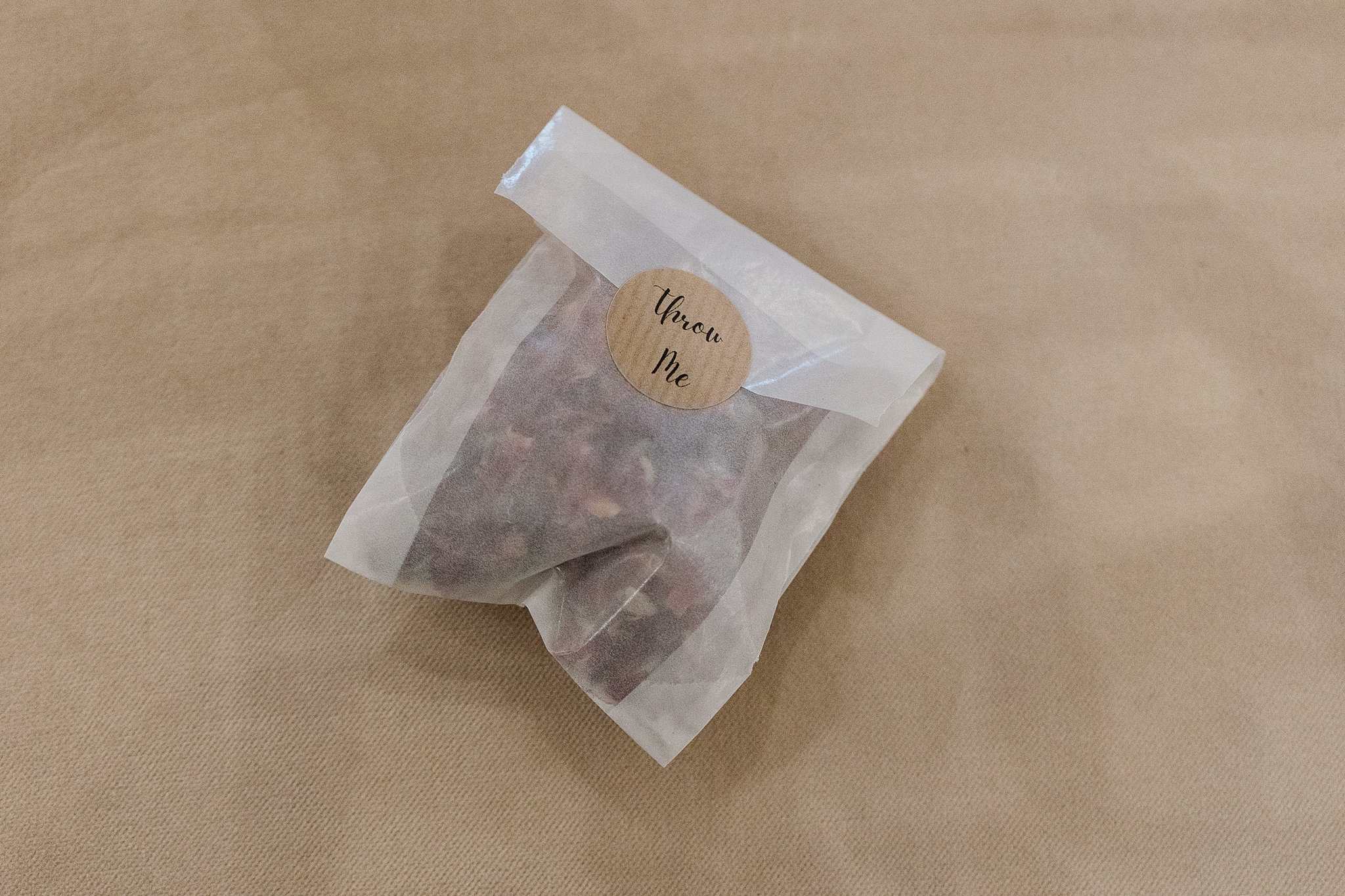 confetti in a translucent pouch with a label reading "throw me"