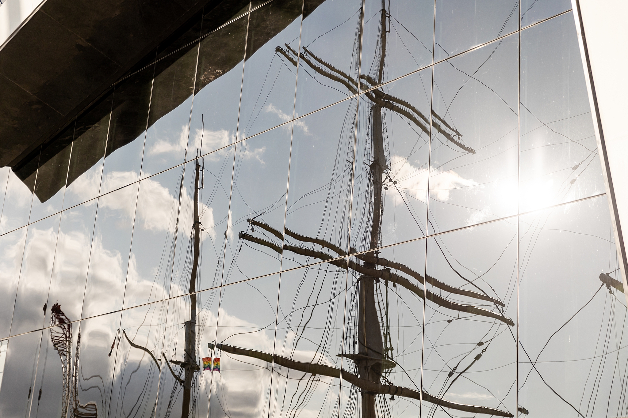 reflection of Tall Ship Glenlee in the glass of the Riverside Transport Museum in Glasgow 