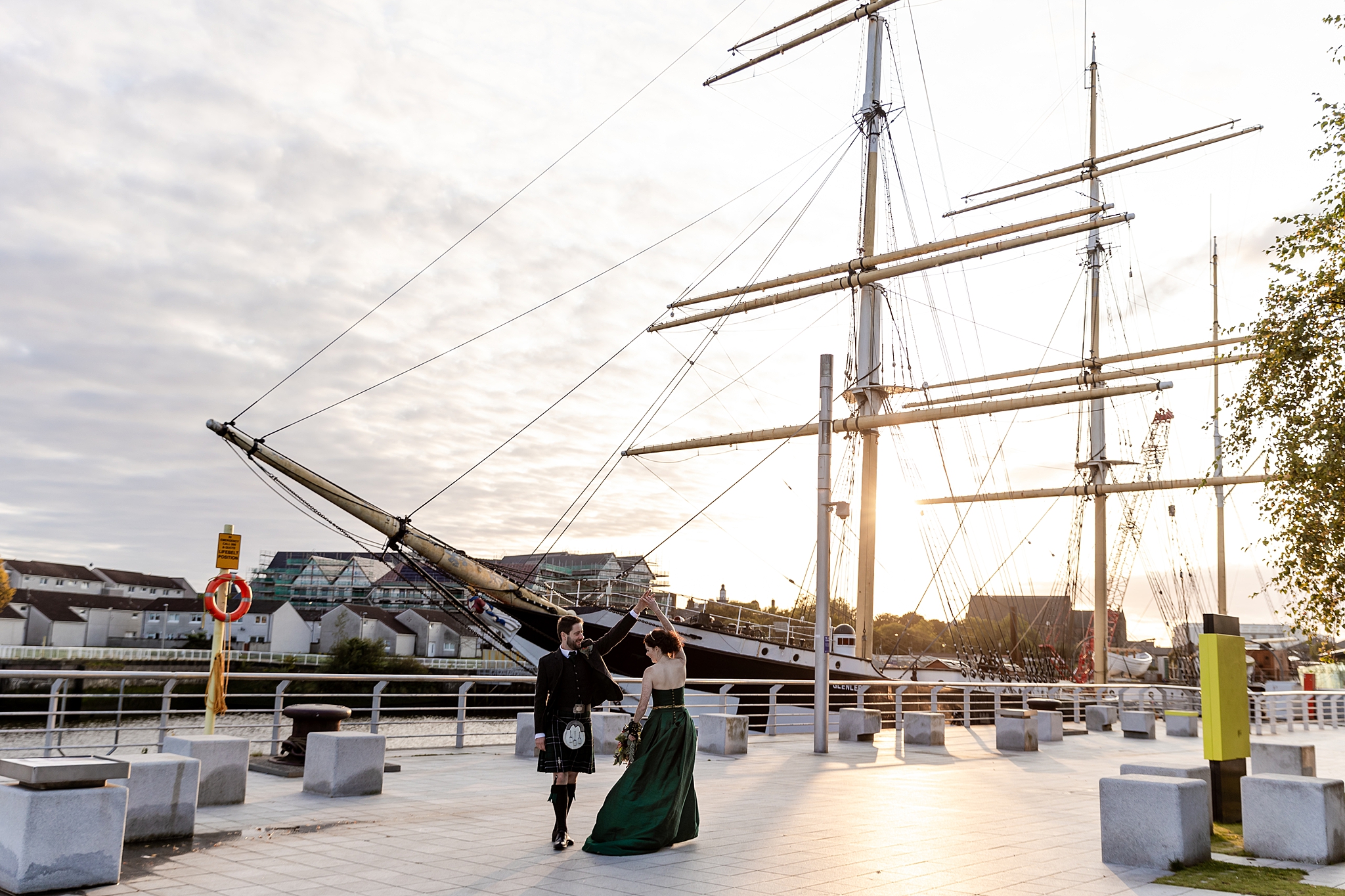 bride and groom dancing in the sunset light in front of Tall Ship Glenlee in Glasgow