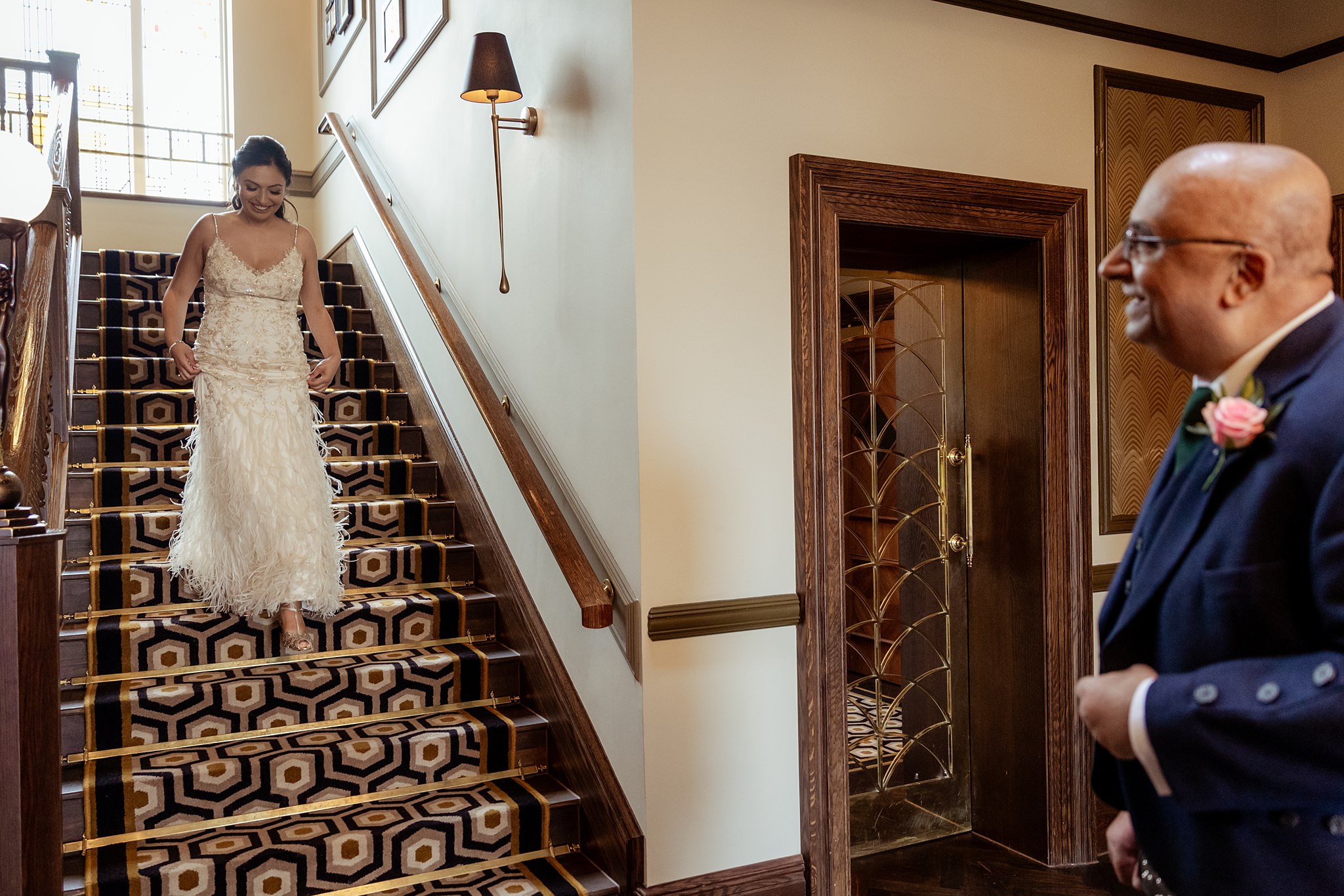 bride walking down staircase in Boclair House to her dad