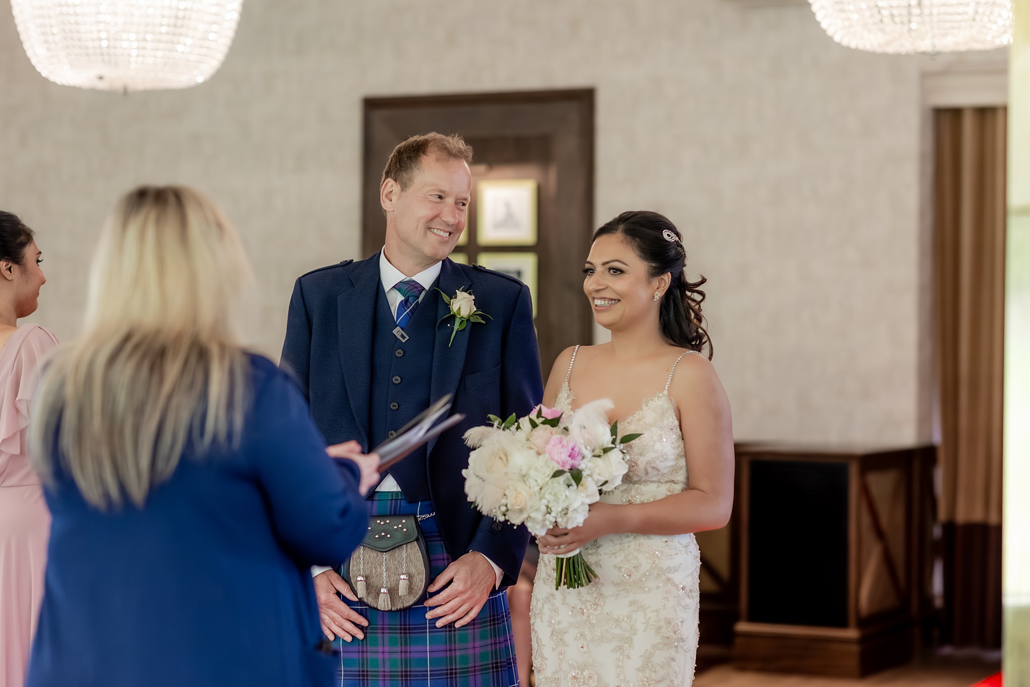 groom smiling at bride during a  wedding in Boclair House