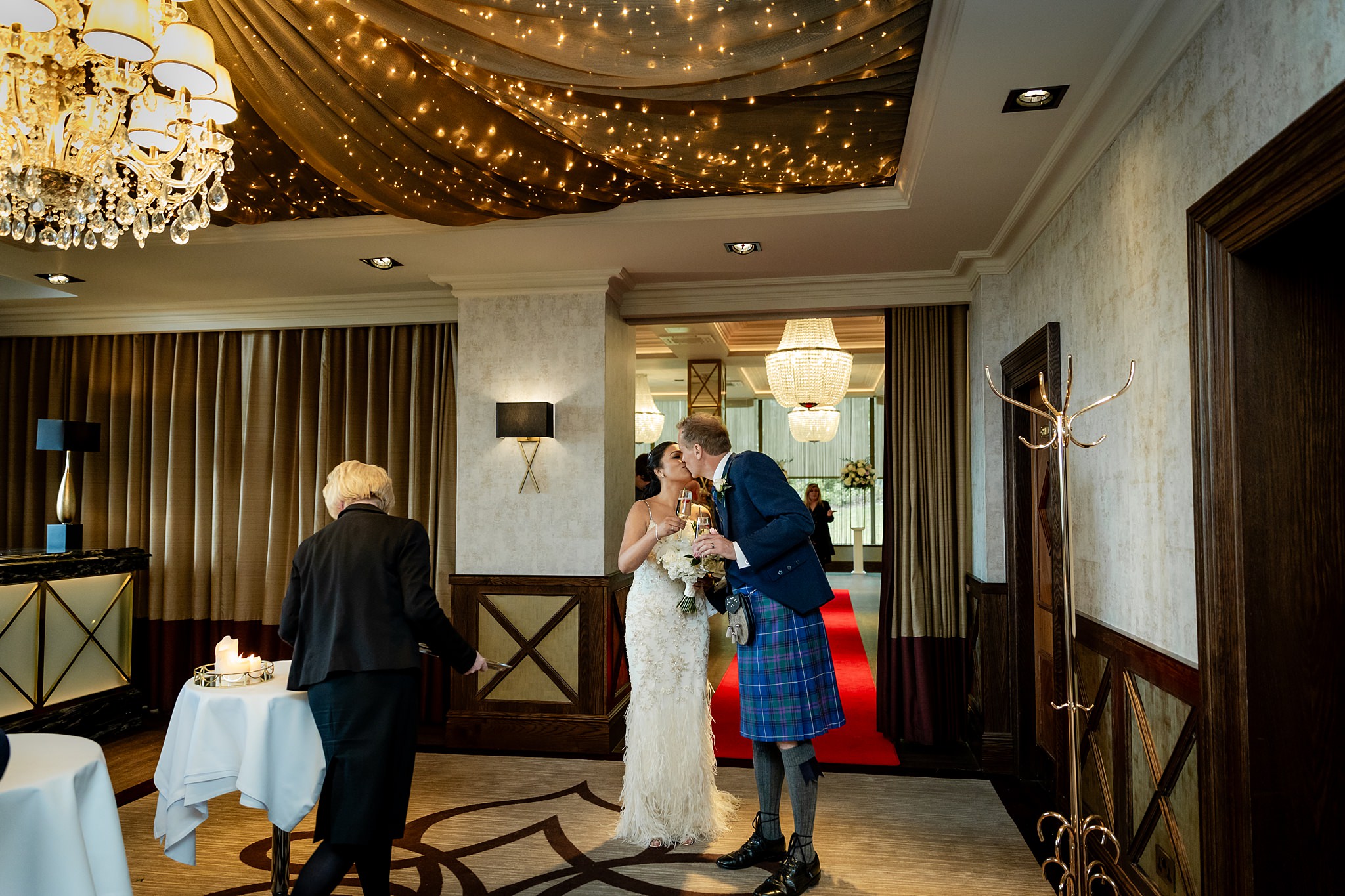 bride and groom kissing after at a wedding in Boclair House