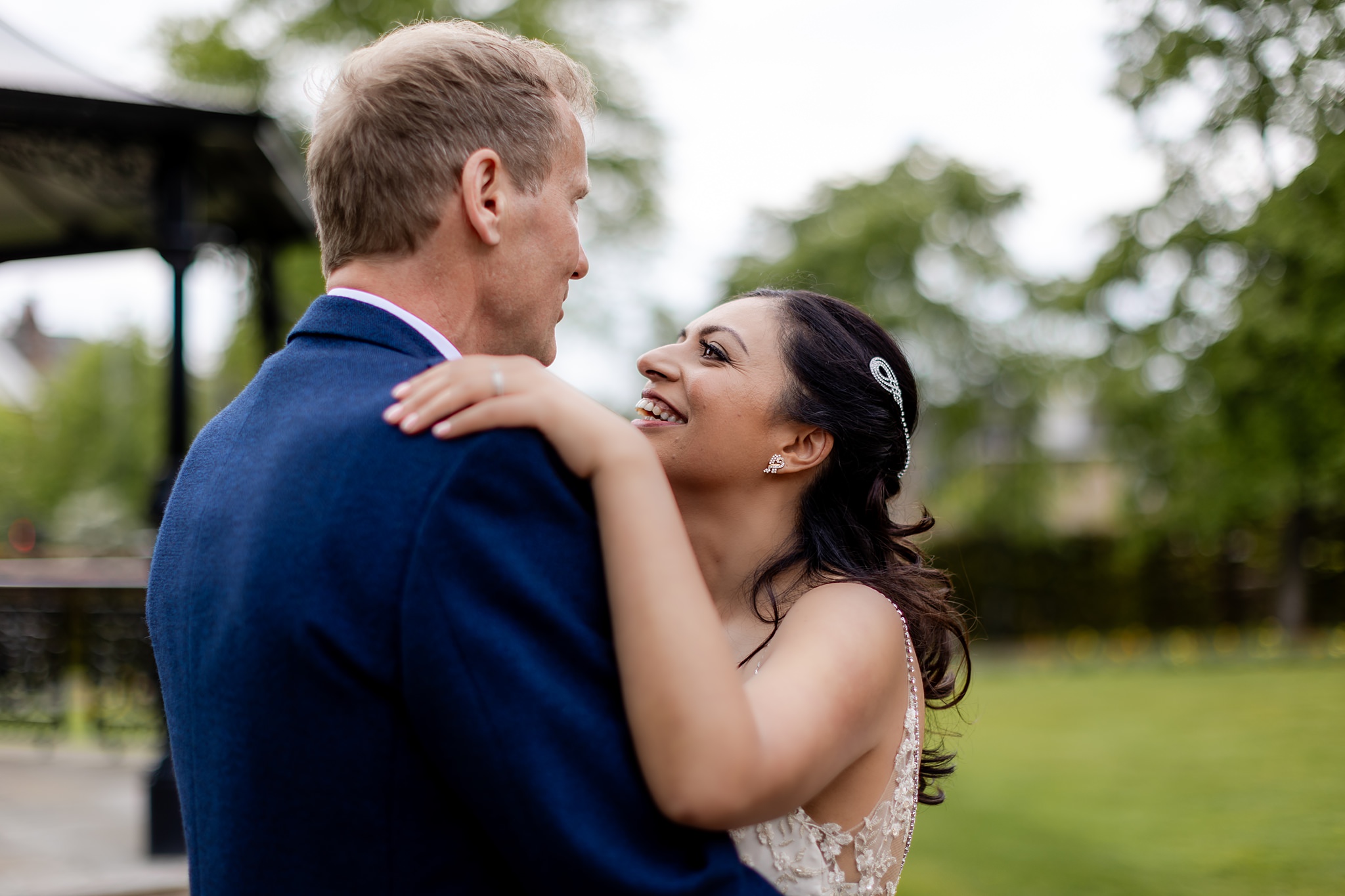 bride smiling at groom 