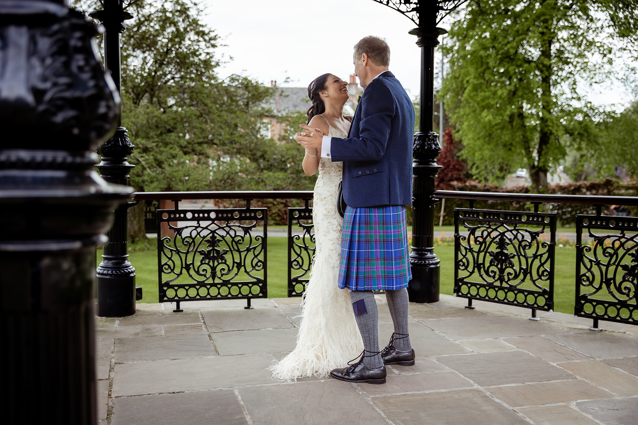 bride and groom waltzing on bandstand outside Boclair House wedding