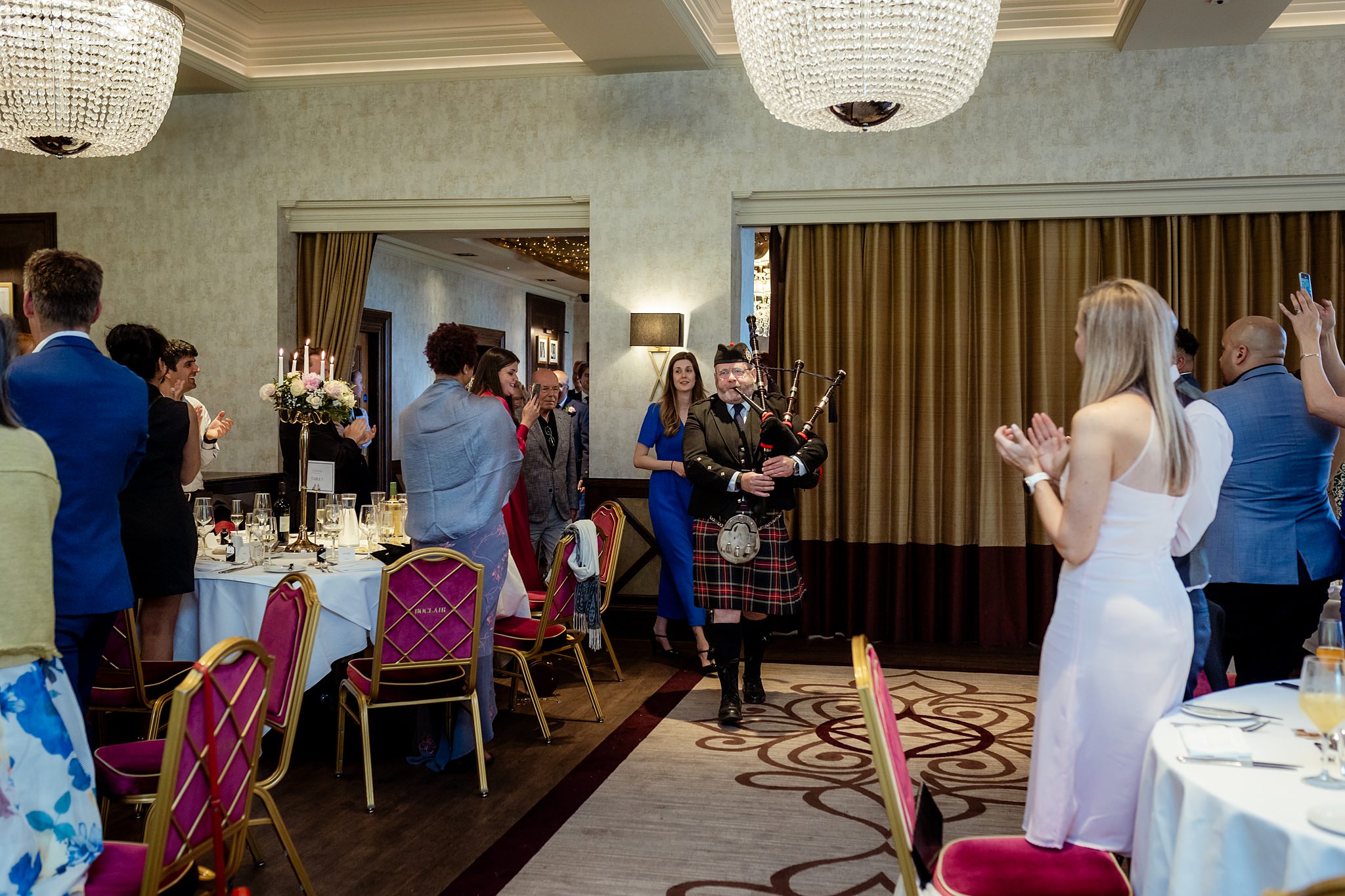 piper marching in with top table at Boclair House