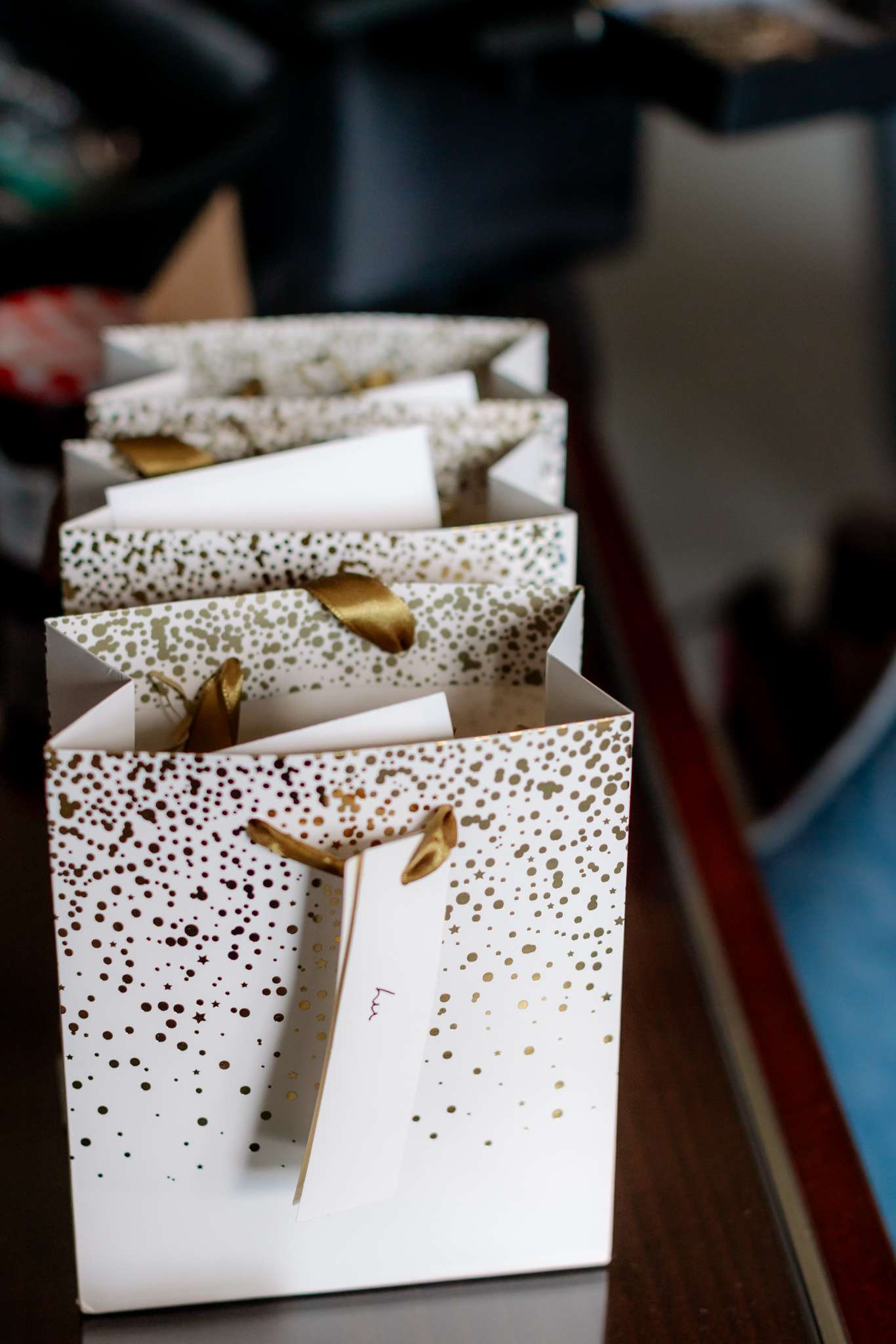 gold and white paper gift bags