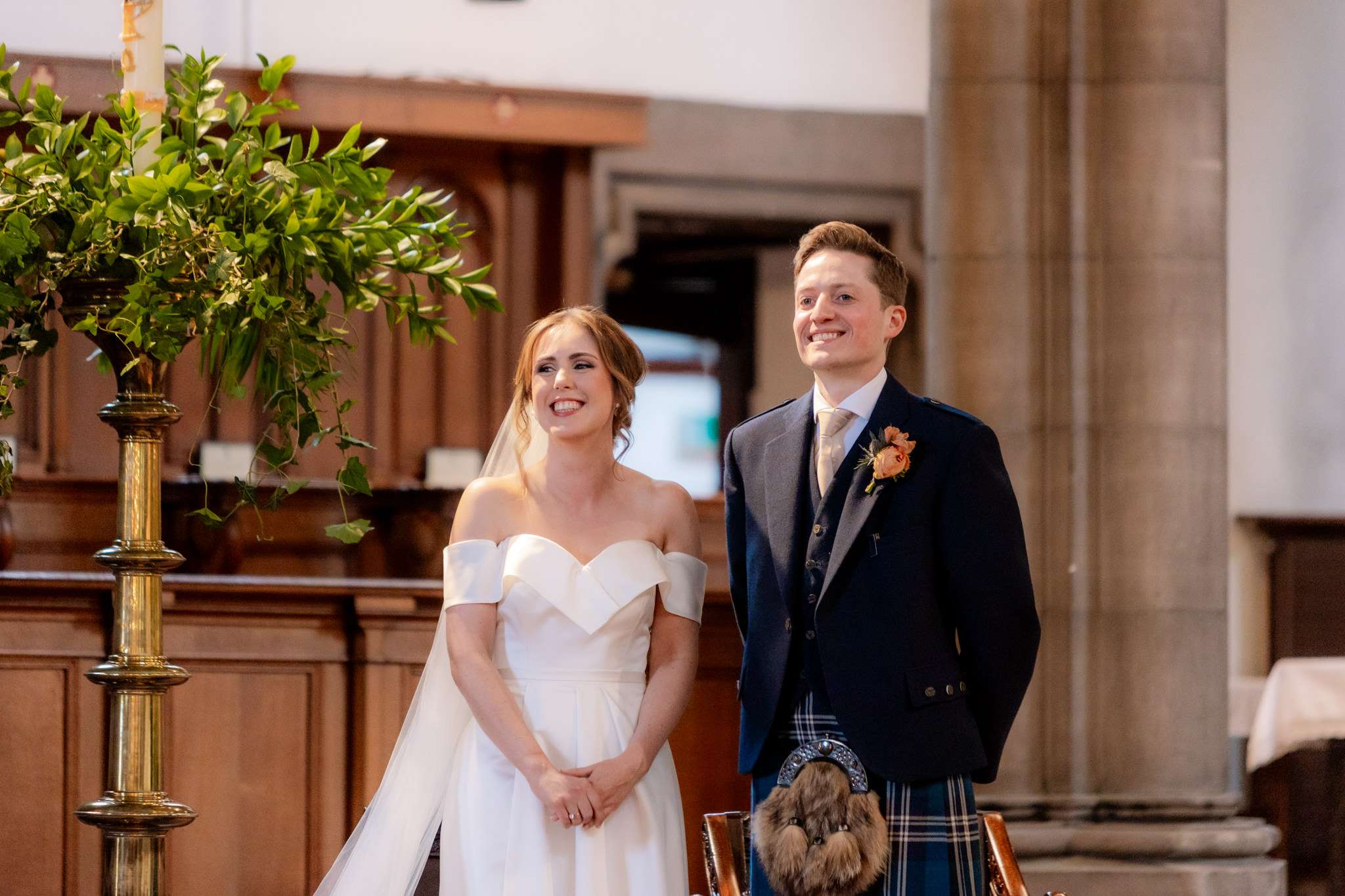 bride and groom smiling at the altar  St Mary's Cathedral Edinburgh 