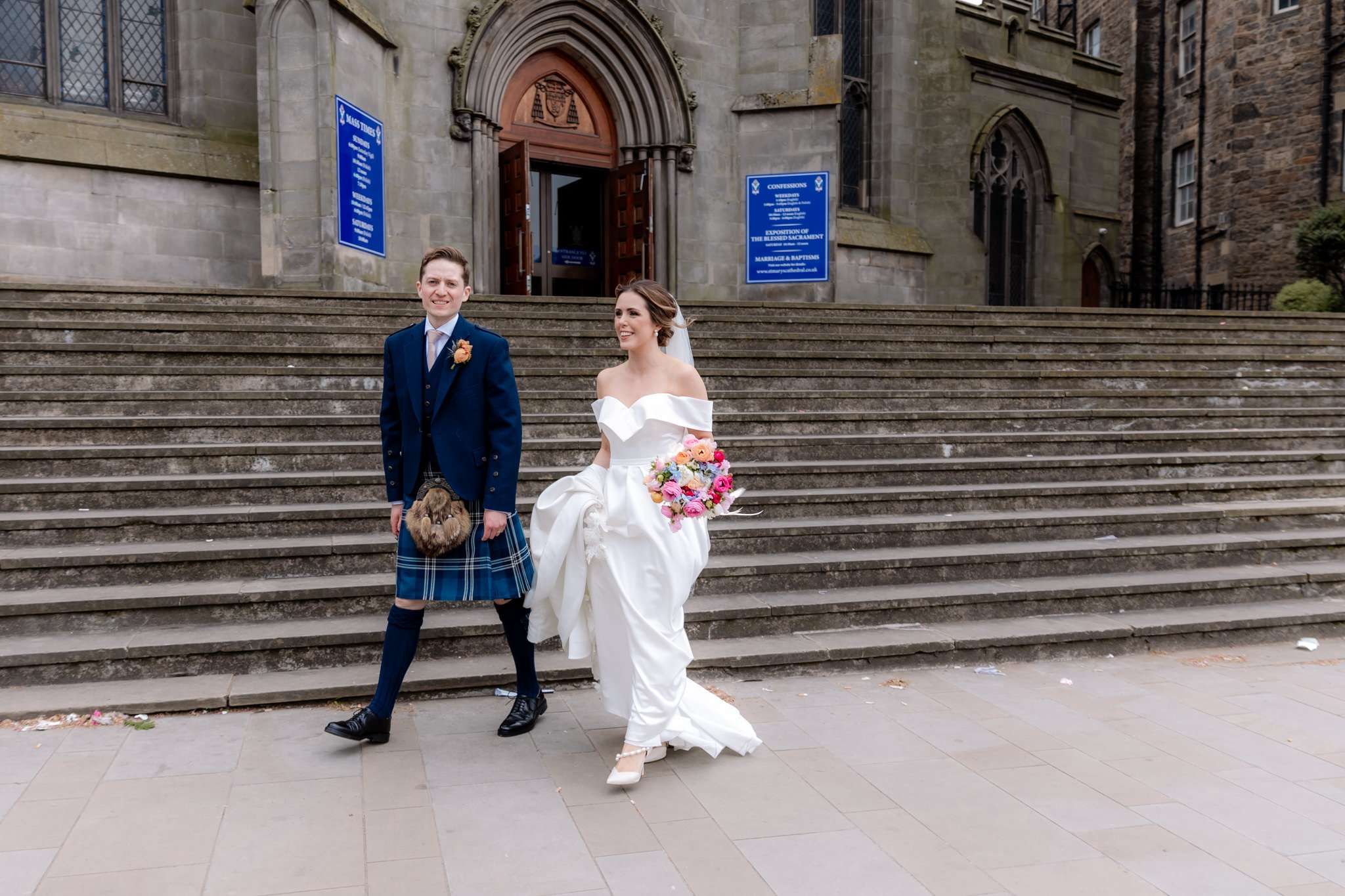 bride and groom outside St Mary's Cathedral, Edinburgh