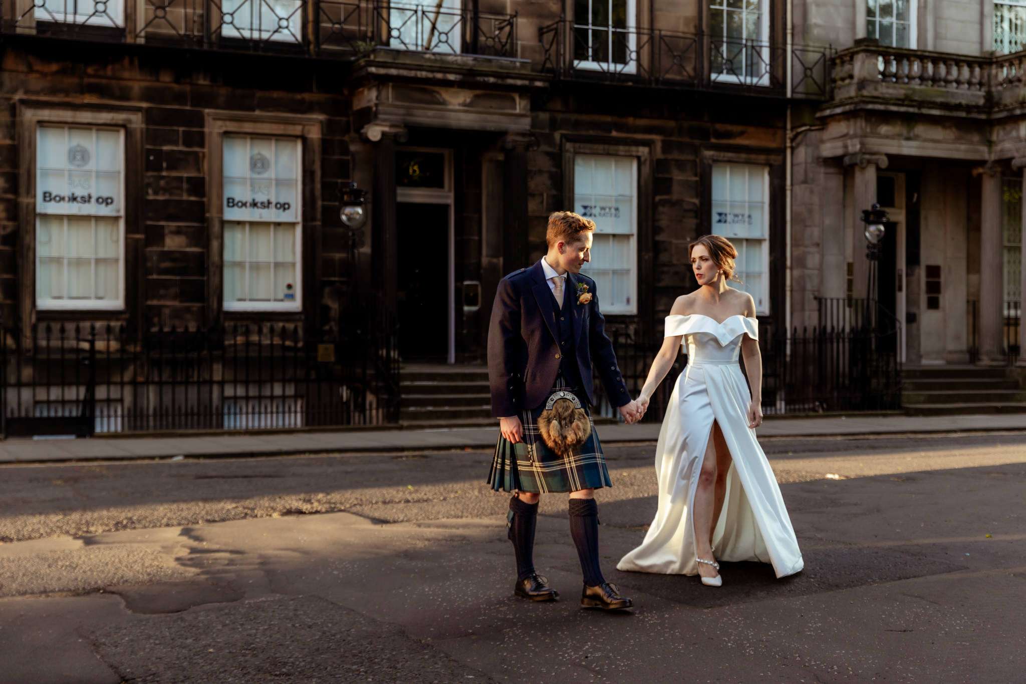 bride and groom in sunshine in Rutland Square near Caledonian Waldorf Hotel in Edinburgh 