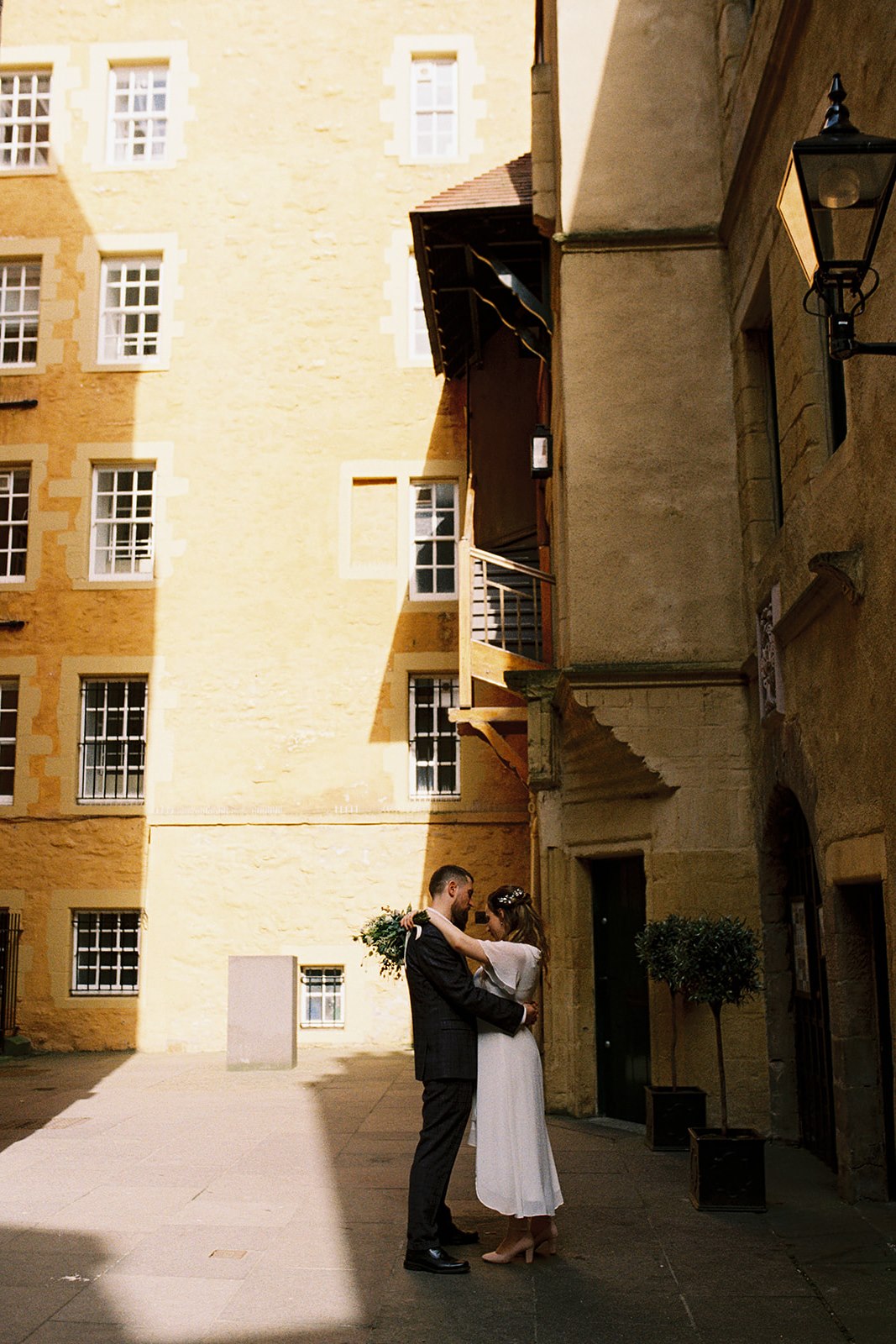 analogue film photograph of a bride and groom at Riddles Court, Edinburgh