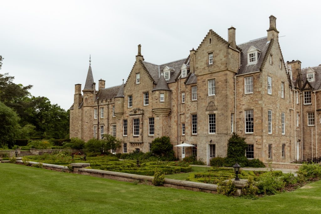 exterior view of Carberry Tower, a luxury wedding venue in East Lothian, Scotland