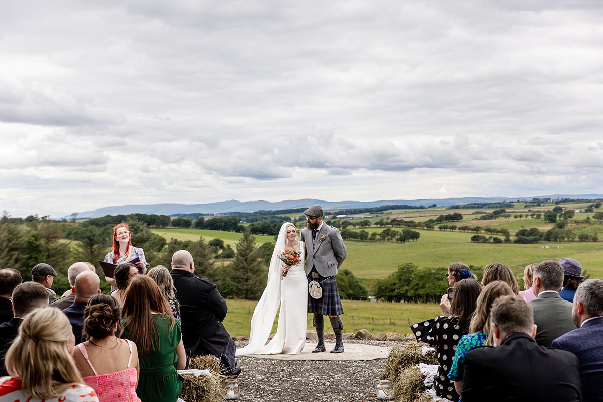 bride and groom during their wedding ceremony at an family farm in Scotland