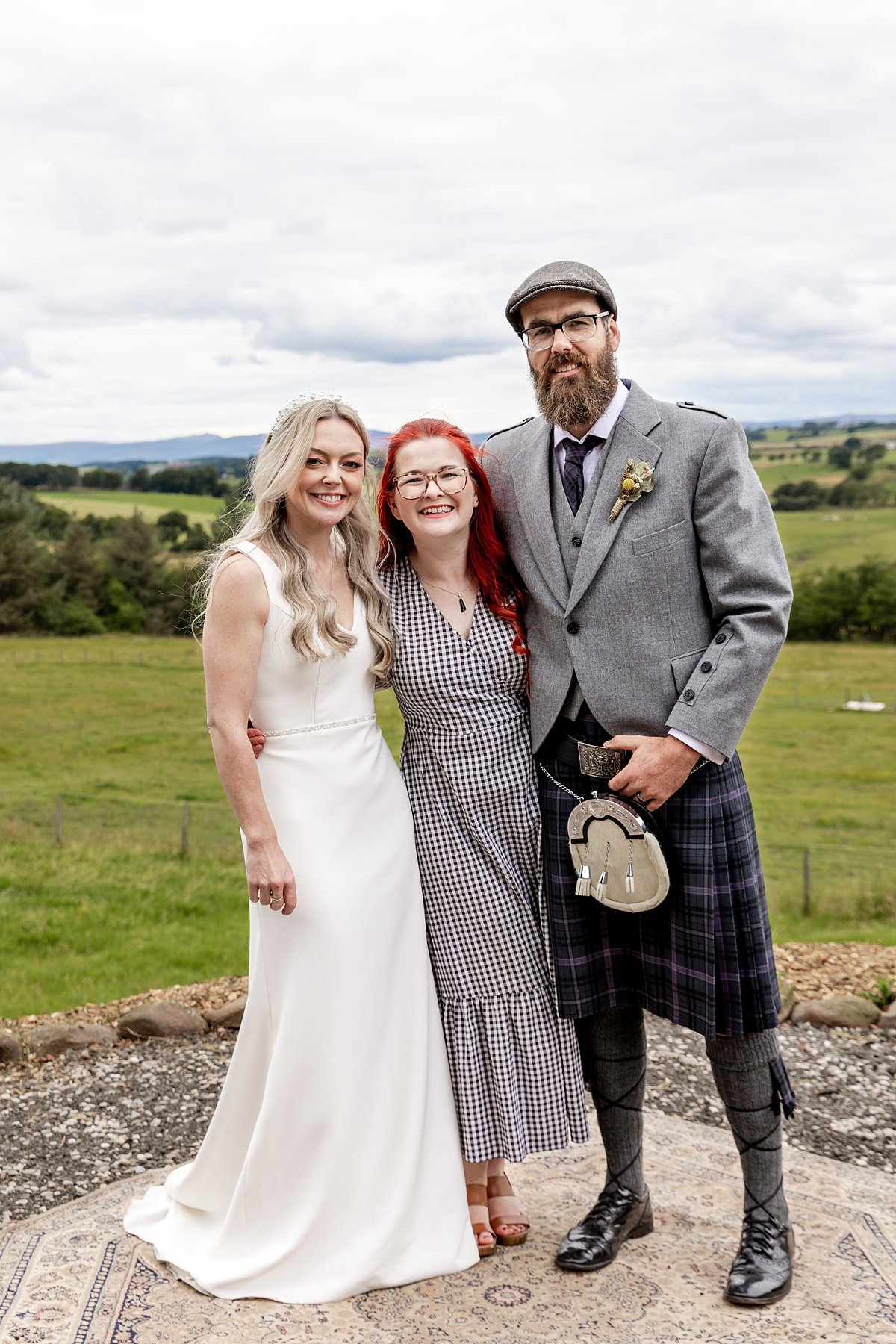 Kathryn Hanson, wedding celebrant, with bride and groom