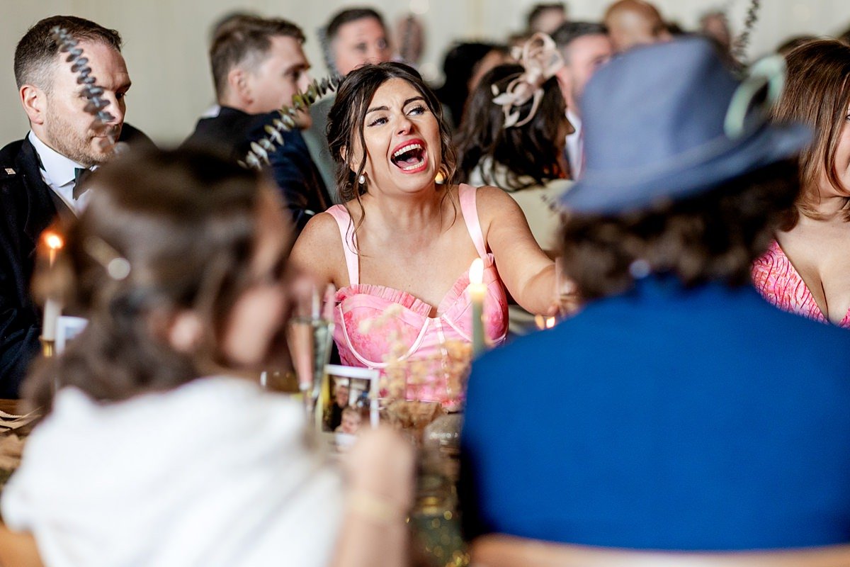 guest laughing during speeches