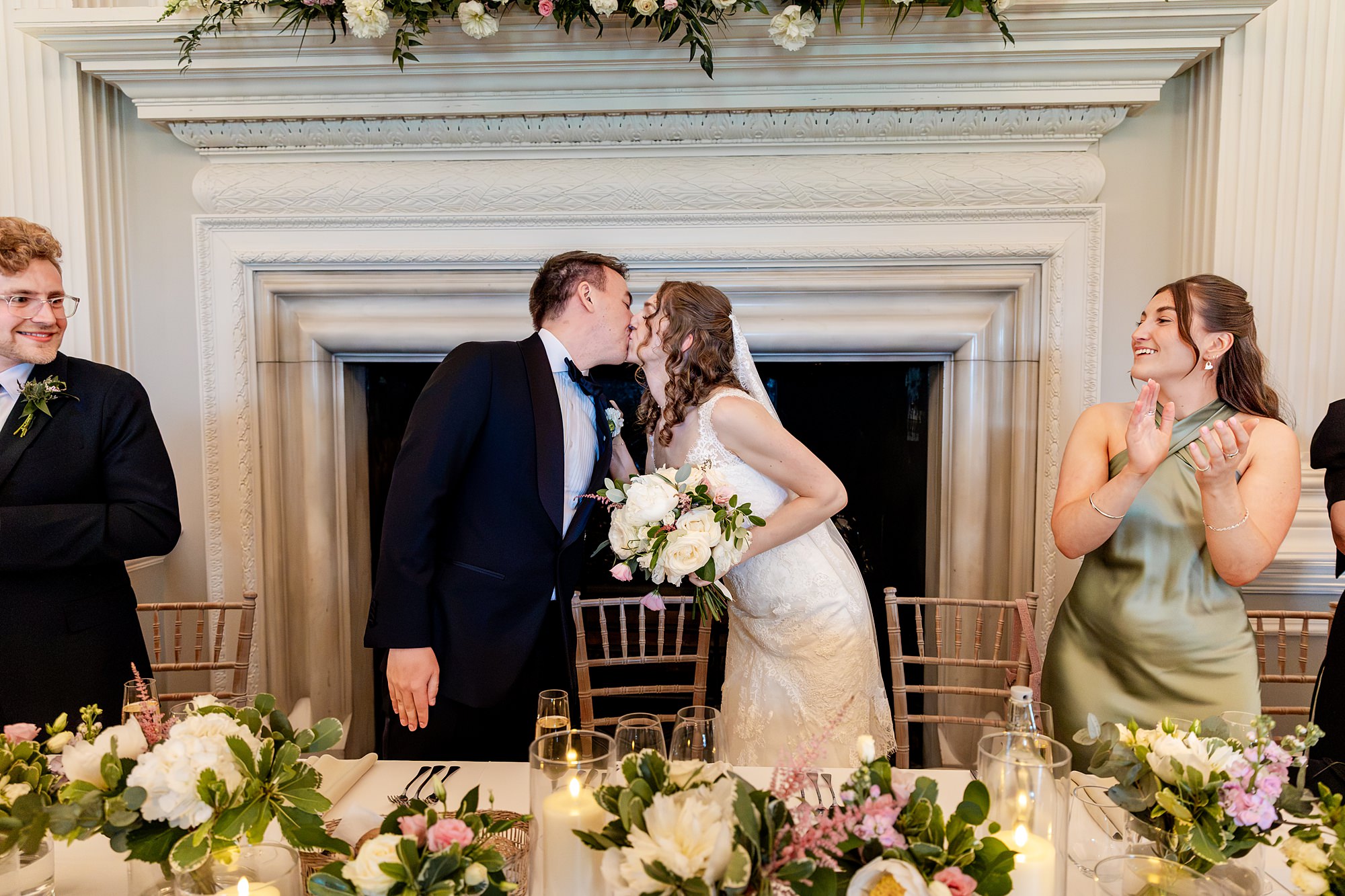 bride and groom kissing before the start of their meal at a Hopetoun House wedding