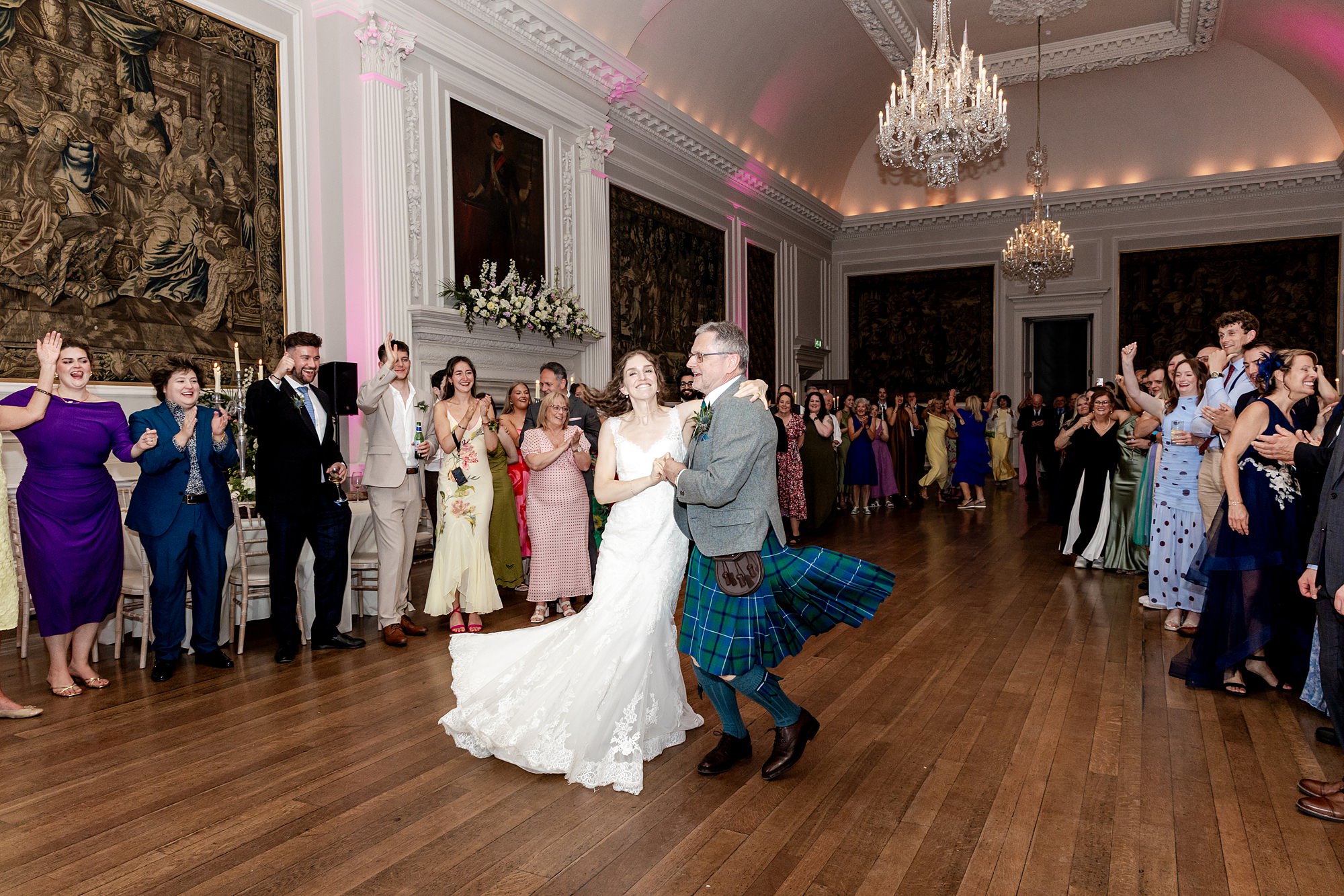 bride and father of the bride in a kilt dancing at Hopetoun House wedding
