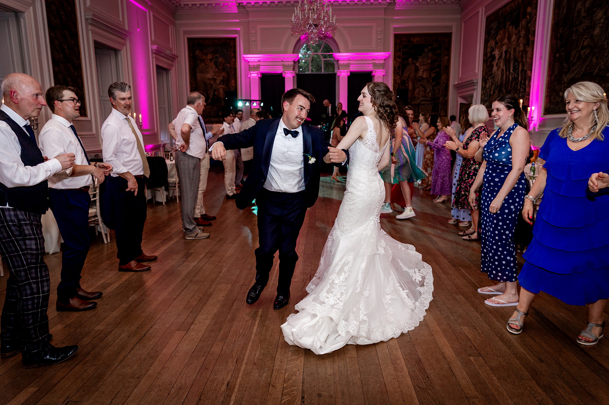 groom and bride dancing Strip the WIllow ceilidh dancing at Hopetoun House wedding