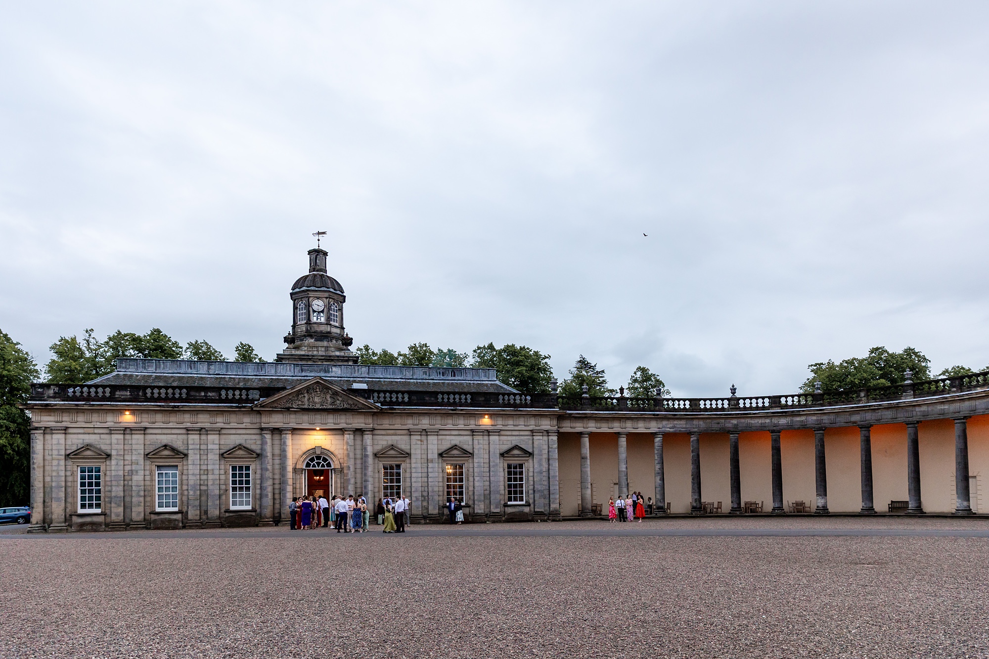 guests mingling outside at Hopetoun House wedding
