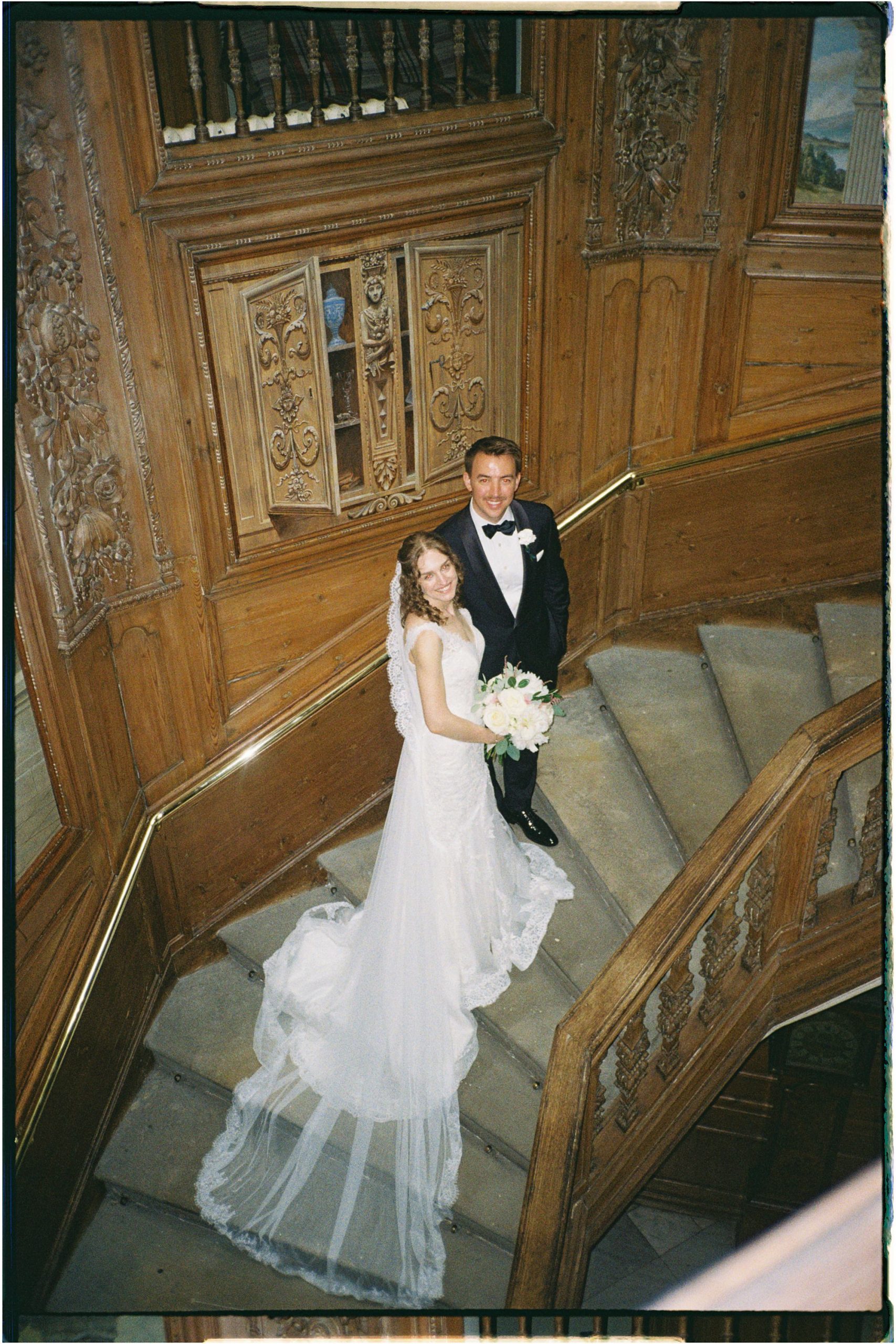 bride and groom in the staircase at Hopetoun House, taken on 35mm film