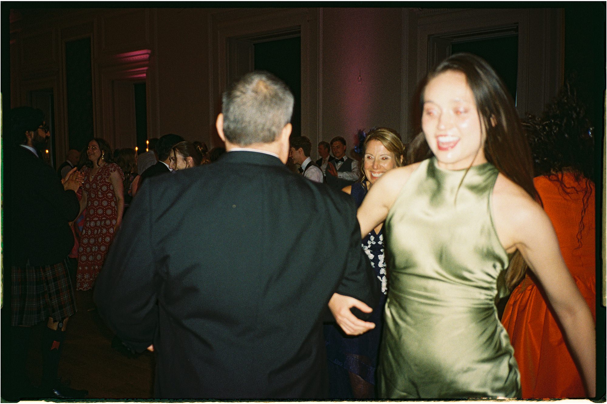 35mm film photo of guests dancing at Hopetoun House wedding